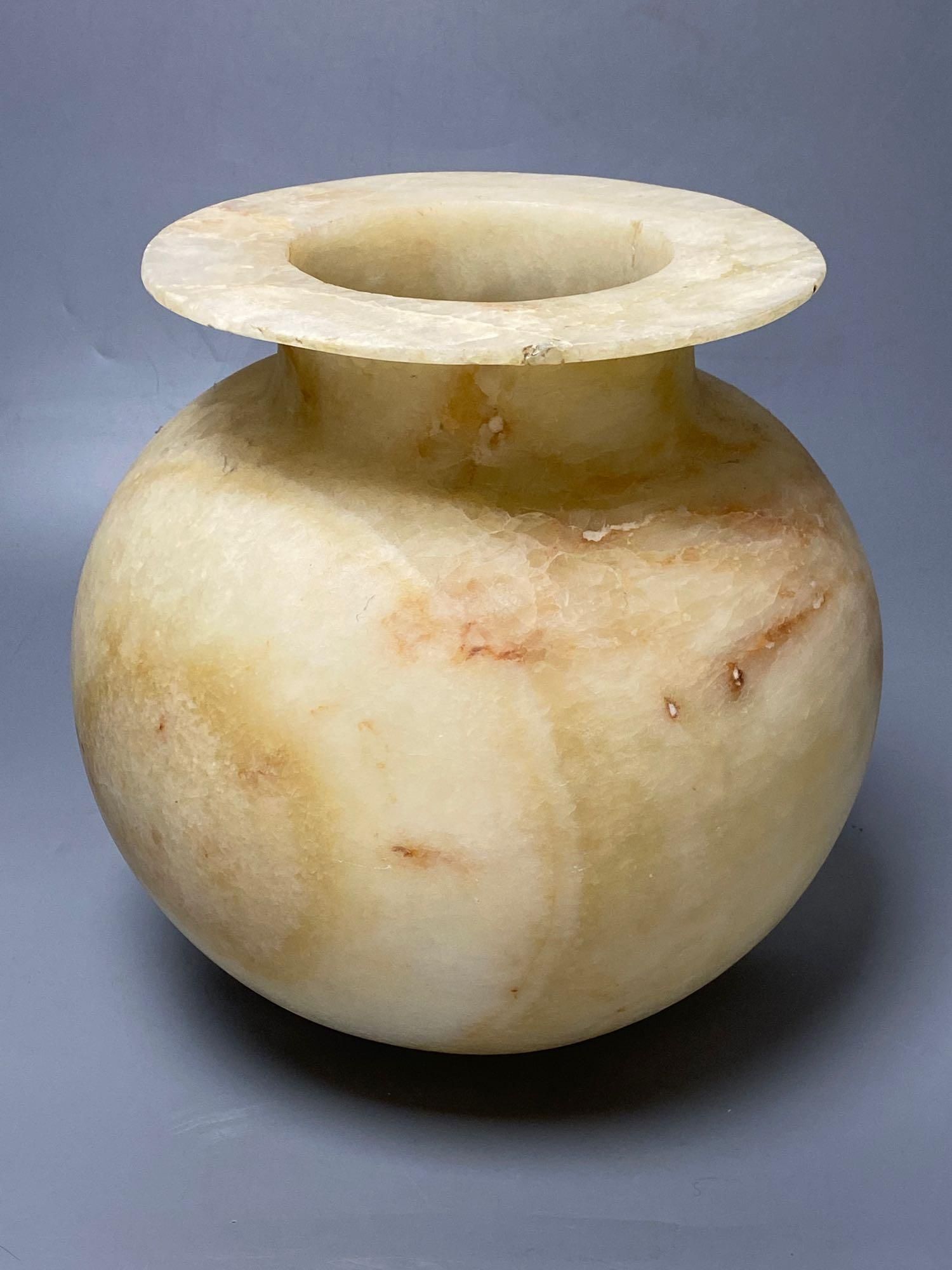 An alabaster bowl with everted rim, height 27cm